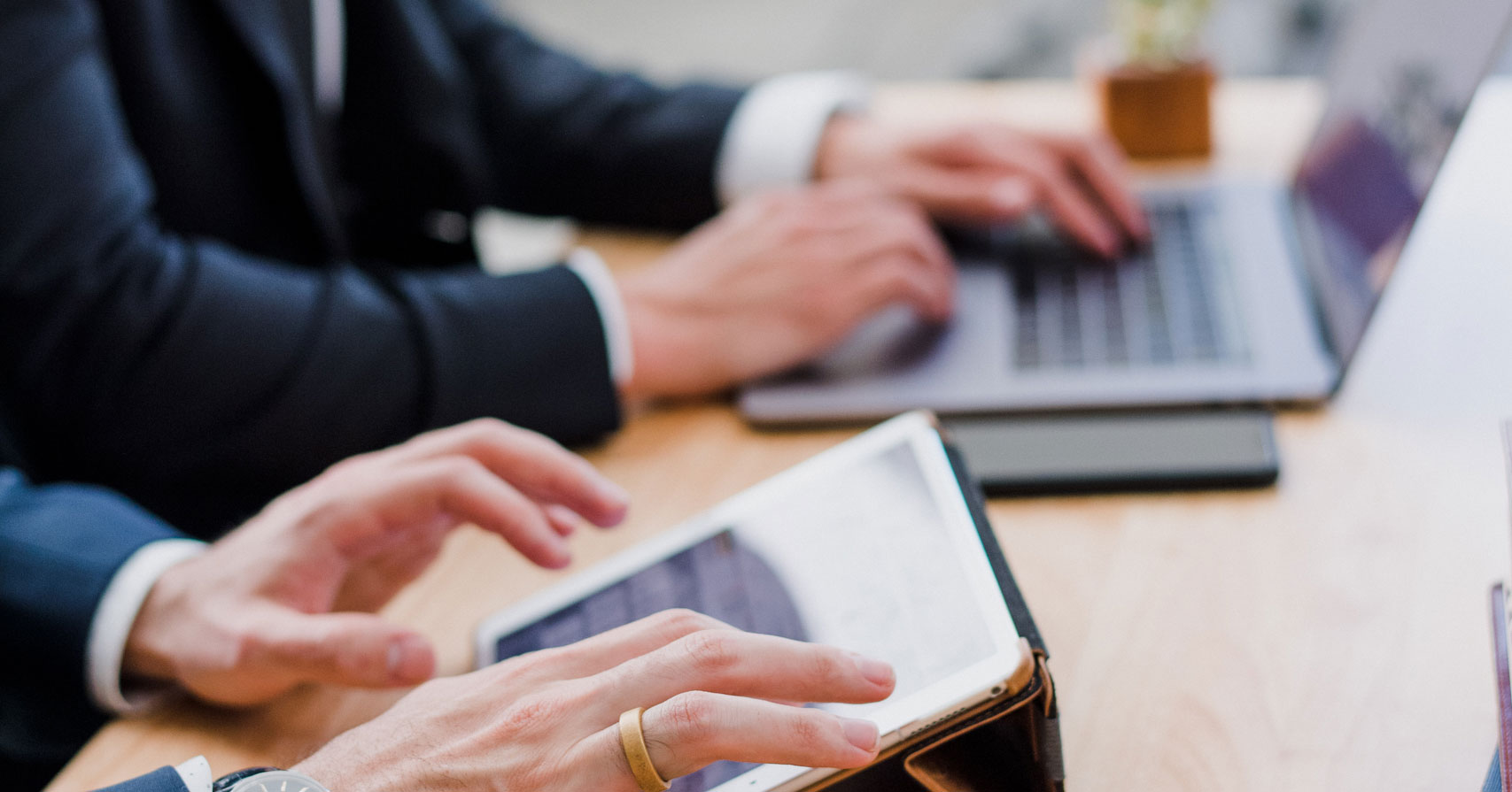 Business meeting using tablets and laptops